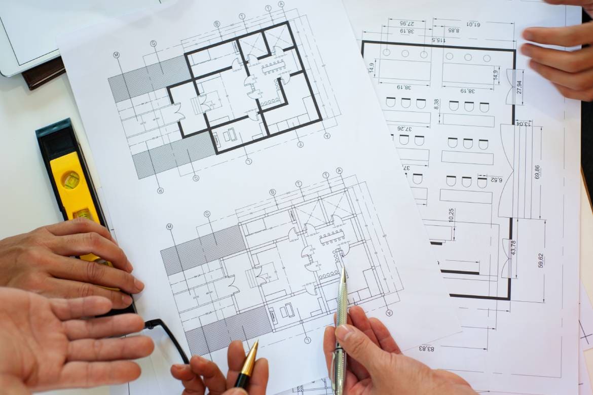 Close-up, architects team are brainstorming, designing and drawing the structure of the building.