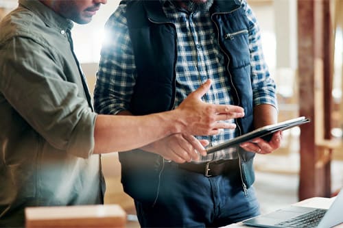 Carpentry, people or hands with tablet in workshop, manufacturing timeline or material cost research. Flare, project planning or men with tech for woodwork schedule, production info or lumber price