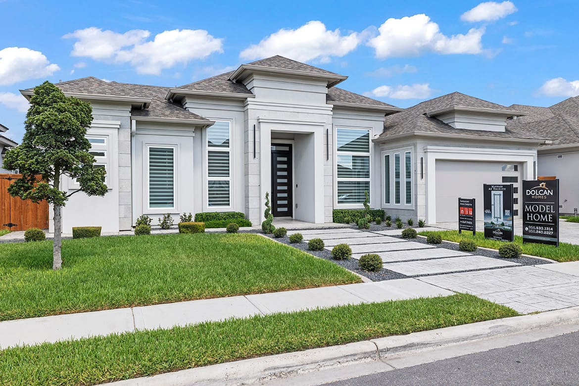 A charming house featuring a driveway and front yard, perfect for growing families in Sharyland ISD.