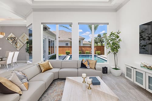 A cozy living room with a large sectional couch and a television, perfect for family entertainment and comfort.