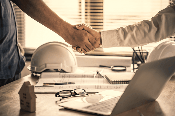 Architect shacking hands with engineer
