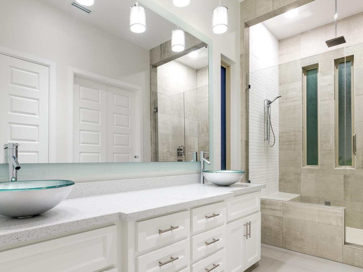 Bathroom interior white with wide mirror and two faucets